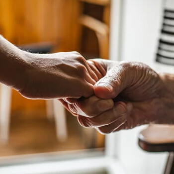 Hands touching.