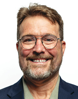 John E. Slatery