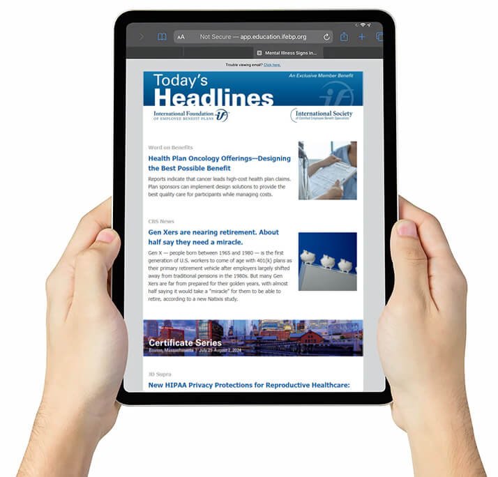 Hands holding tablet displaying Today's Headlines